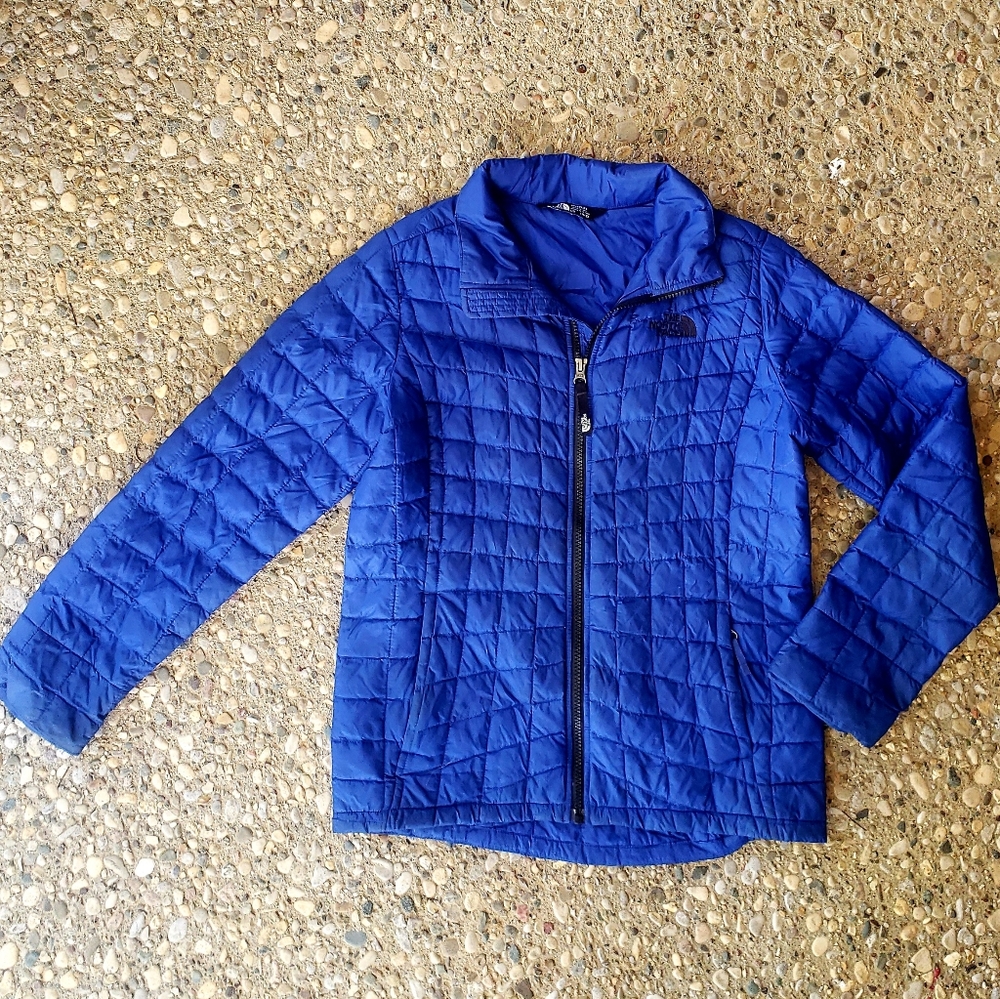 North Face girl's blue puffer jacket.